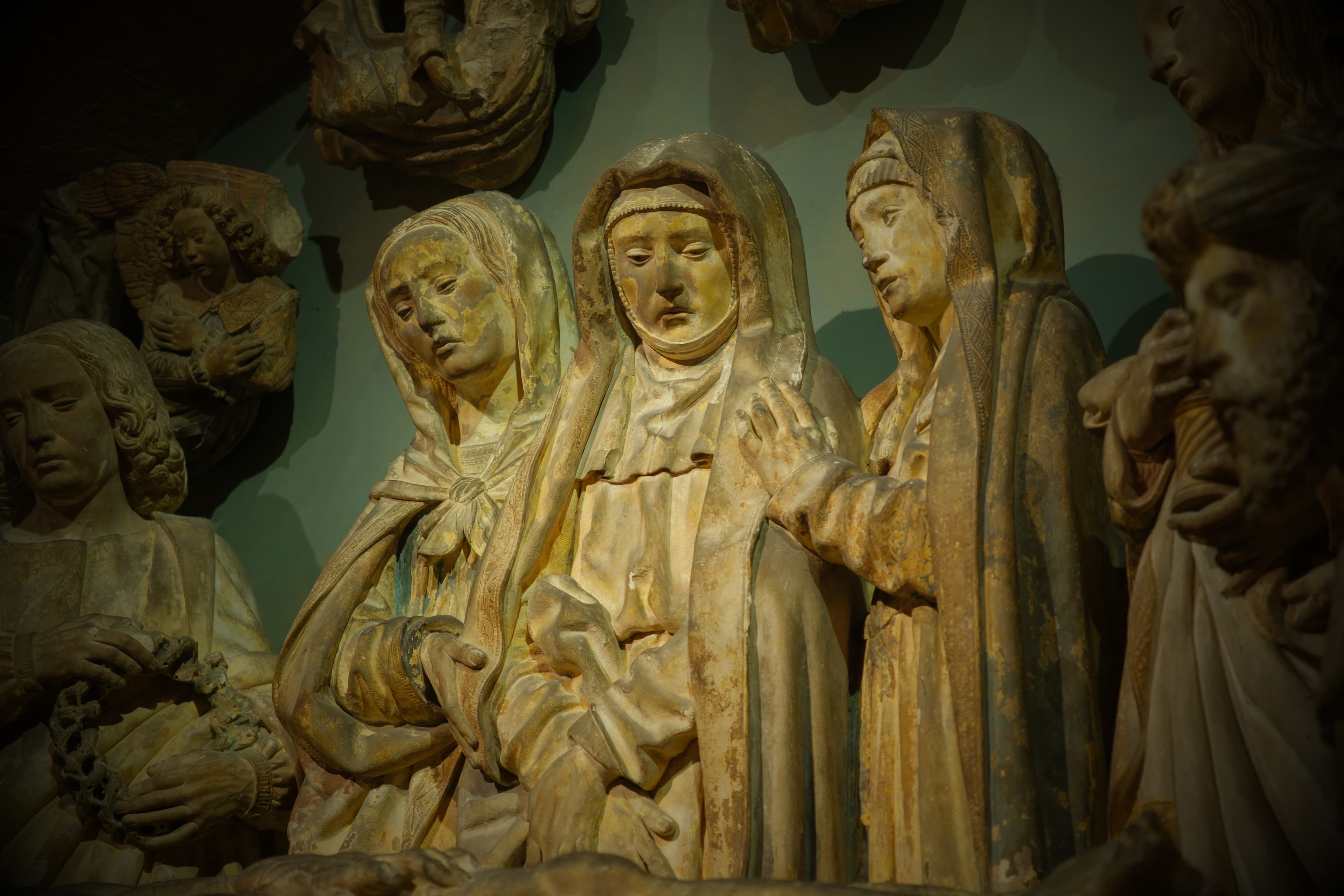 Prayerful statues displayed inside the Metropolitan Museum of Art.